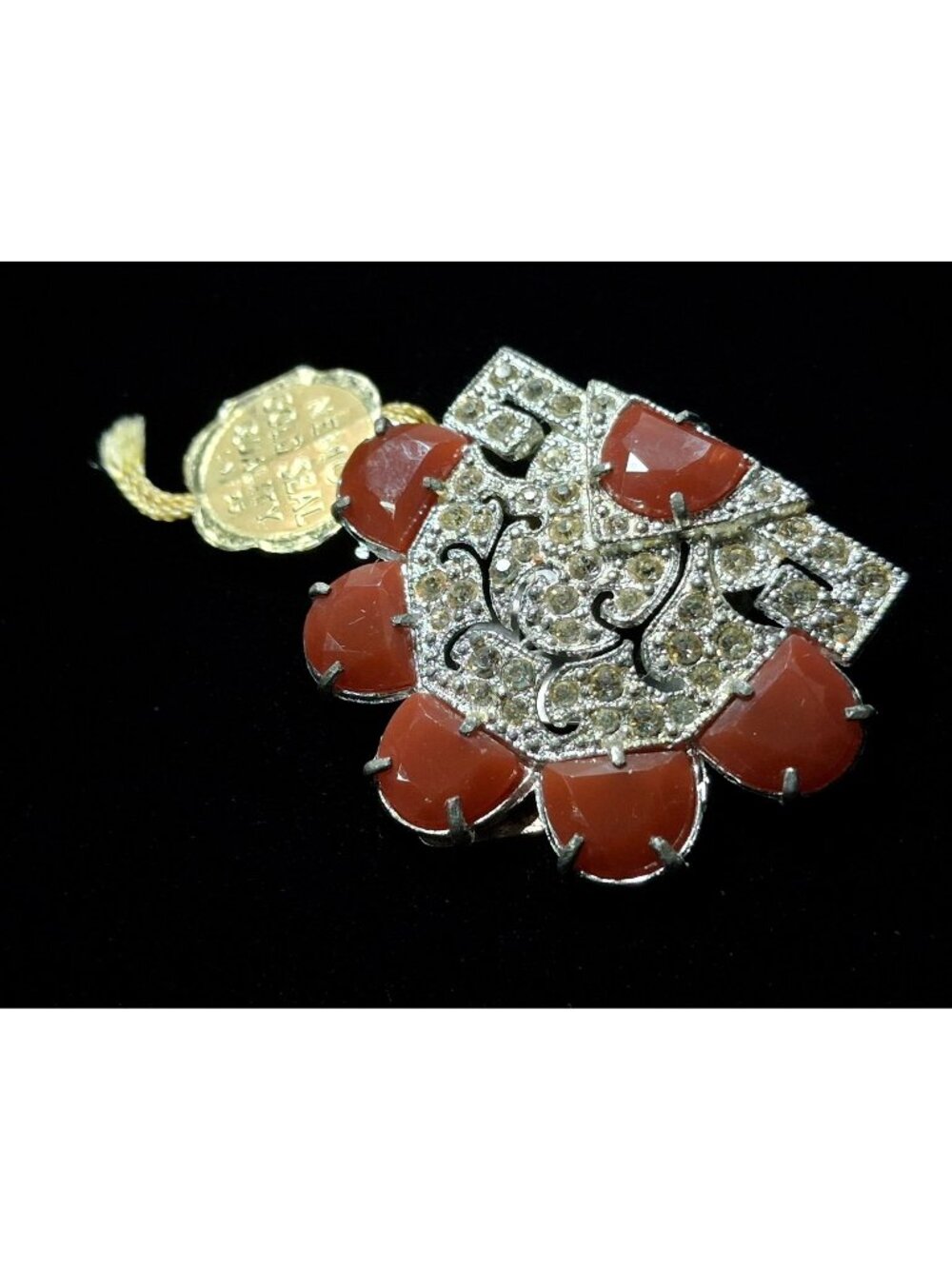 Little Nemo Dress Clip Circa 1940's Pot Metal Filigree Faux Carnelian Lucite